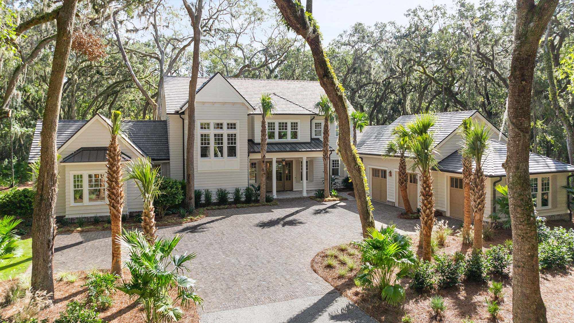 House With palm trees in the front